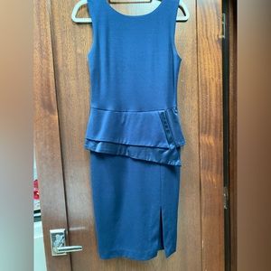 Navy peplum waist sheath dress.
